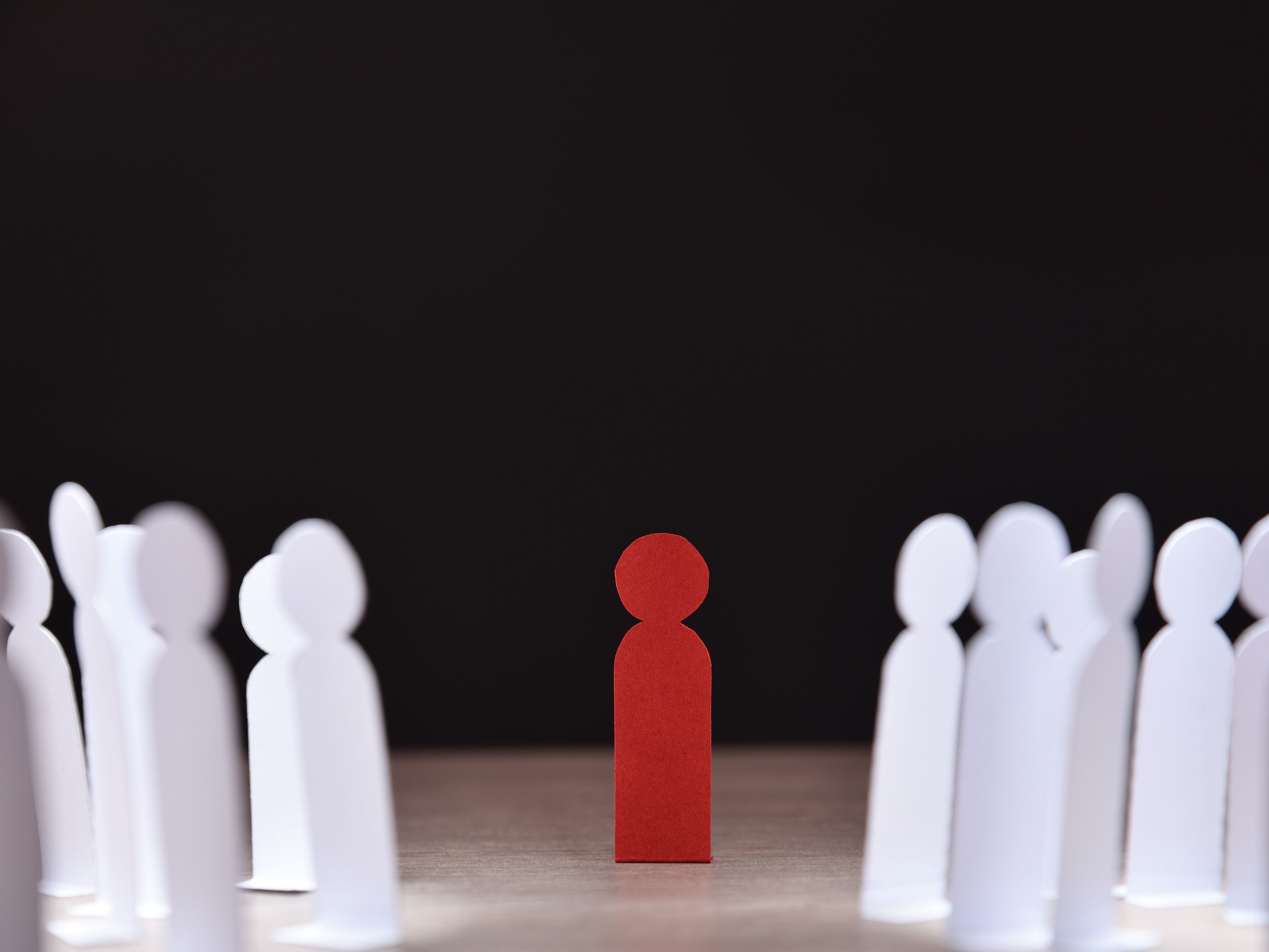 Tile picture with white silhouette figures circling a red figure (link to "Anti-discrimination and harassment")