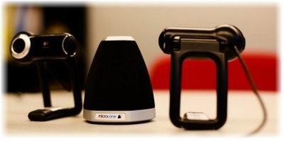 Figure 1. The recording sensors of the portable setup on the ELEA corpus. Two webcameras and the Microcone.